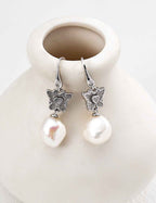 Close-up of 925 sterling silver drop earrings