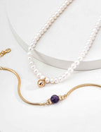 Sterling silver amethyst bracelet worn on wrist, slim chain with center stone