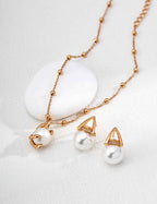 925 sterling silver triangular frame faux pearl earrings, front view