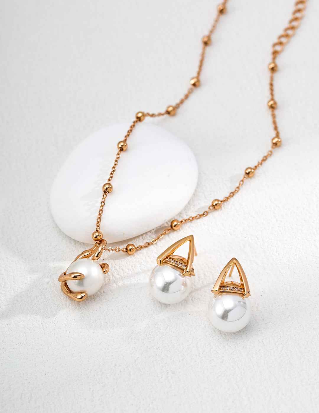 925 sterling silver triangular frame faux pearl earrings, front view