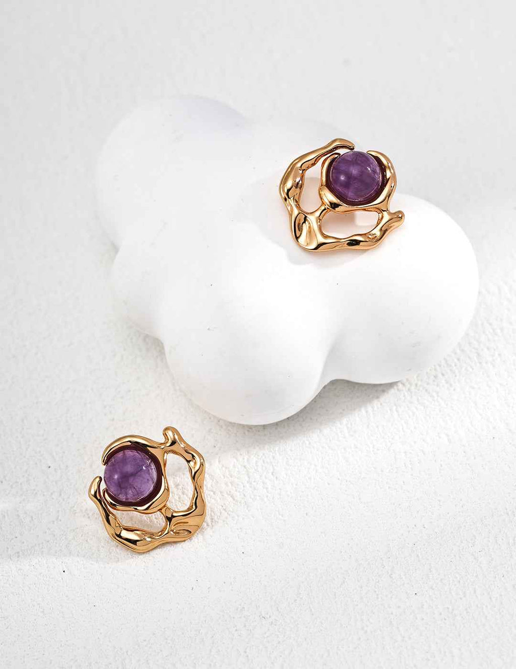 Pair of 925 sterling silver amethyst stud earrings with sculptural metal frame