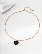 Full length view of 925 sterling silver black enamel heart necklace, 40 cm chain