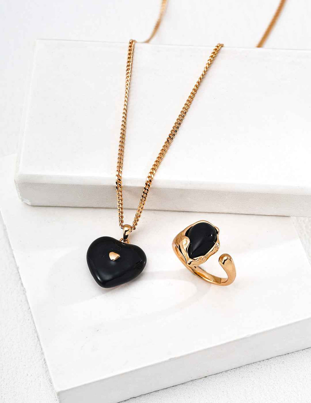 925 sterling silver necklace with compact heart-shaped black enamel pendant, vintage gold tone