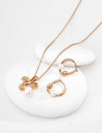 Close-up of sterling silver curved hoop earring showing natural pearl placement on curved form