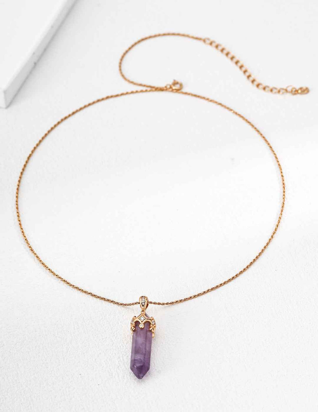 Full view of 925 sterling silver amethyst crystal point pendant necklace, vertical silhouette