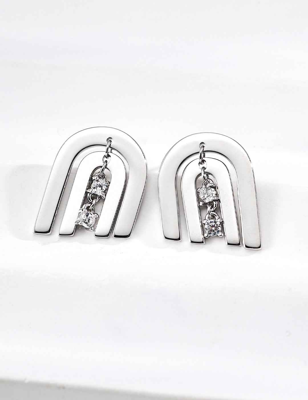 Pair of 925 sterling silver cubic zirconia arc stud earrings