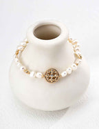 925 sterling silver pearl bracelet with openwork floral charm, vintage gold tone