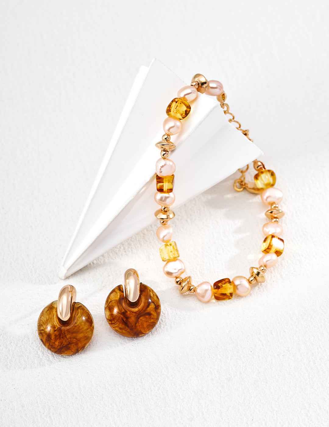 925 sterling silver amber and pearl bracelet worn on wrist, showing adjustable chain