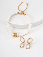 Pair of 925 sterling silver cubic zirconia drop hoop earrings displayed
