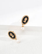 Pair of 925 sterling silver black enamel drop earrings with pearl accent
