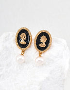925 sterling silver drop earrings with black enamel oval, gold-tone frame, and natural pearl drop, approx. 2.5 cm