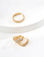 Close-up of sterling silver double wave CZ stud earring showing curved form and stone detail