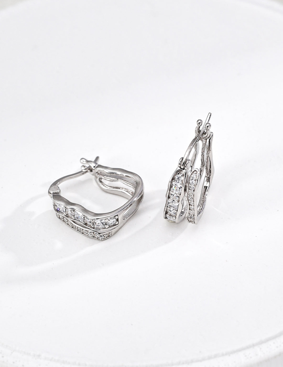 Pair of 925 sterling silver CZ double wave stud earrings, front view