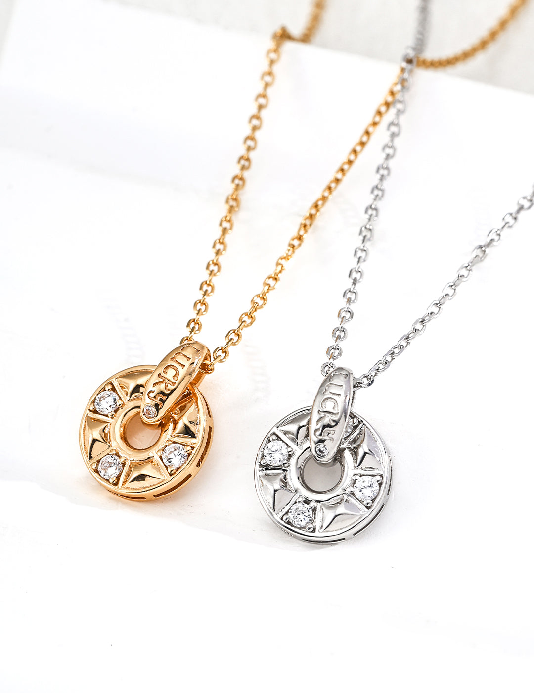 925 sterling silver coin pendant necklace with cubic zirconia, circular engraved design, gold tone