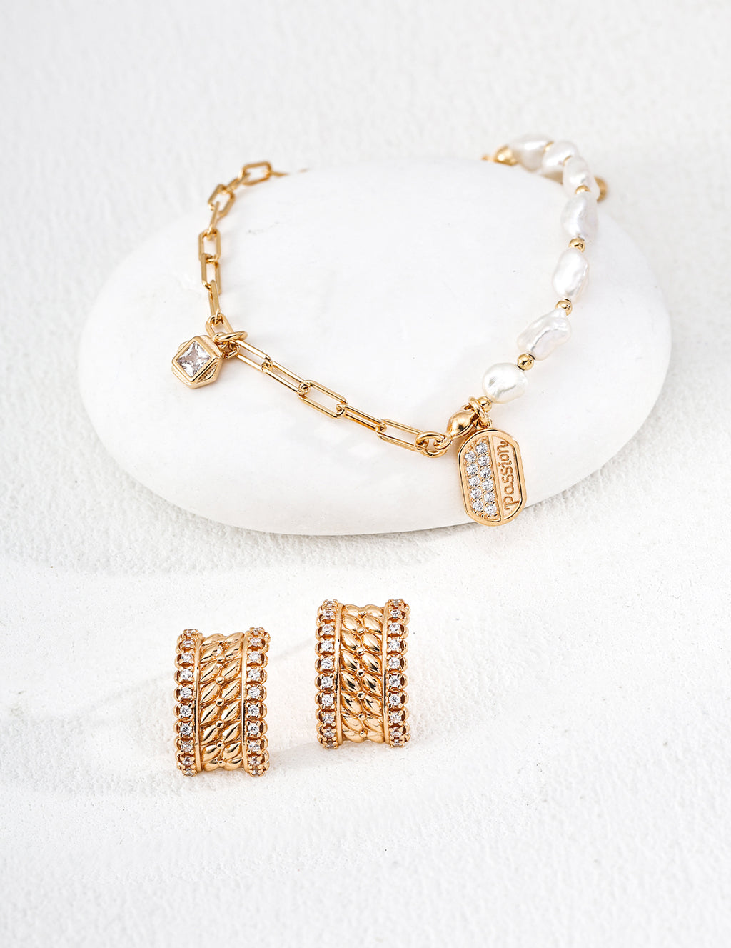 Close-up of sterling silver textured CZ stud earring showing dimensional mesh surface