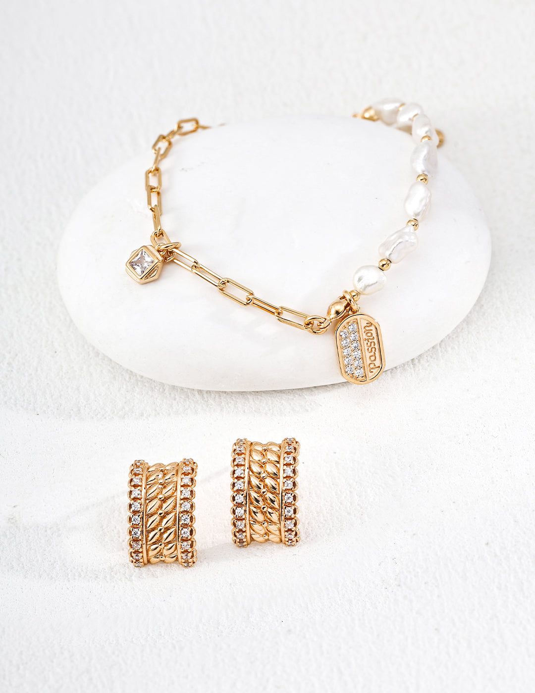 Close-up of sterling silver textured CZ stud earring showing dimensional mesh surface