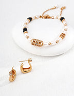 Pair of 925 sterling silver curved CZ hoop earrings displayed
