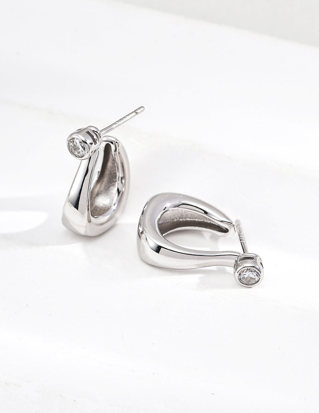 925 sterling silver curved zirconia hoop earrings, silver tone version