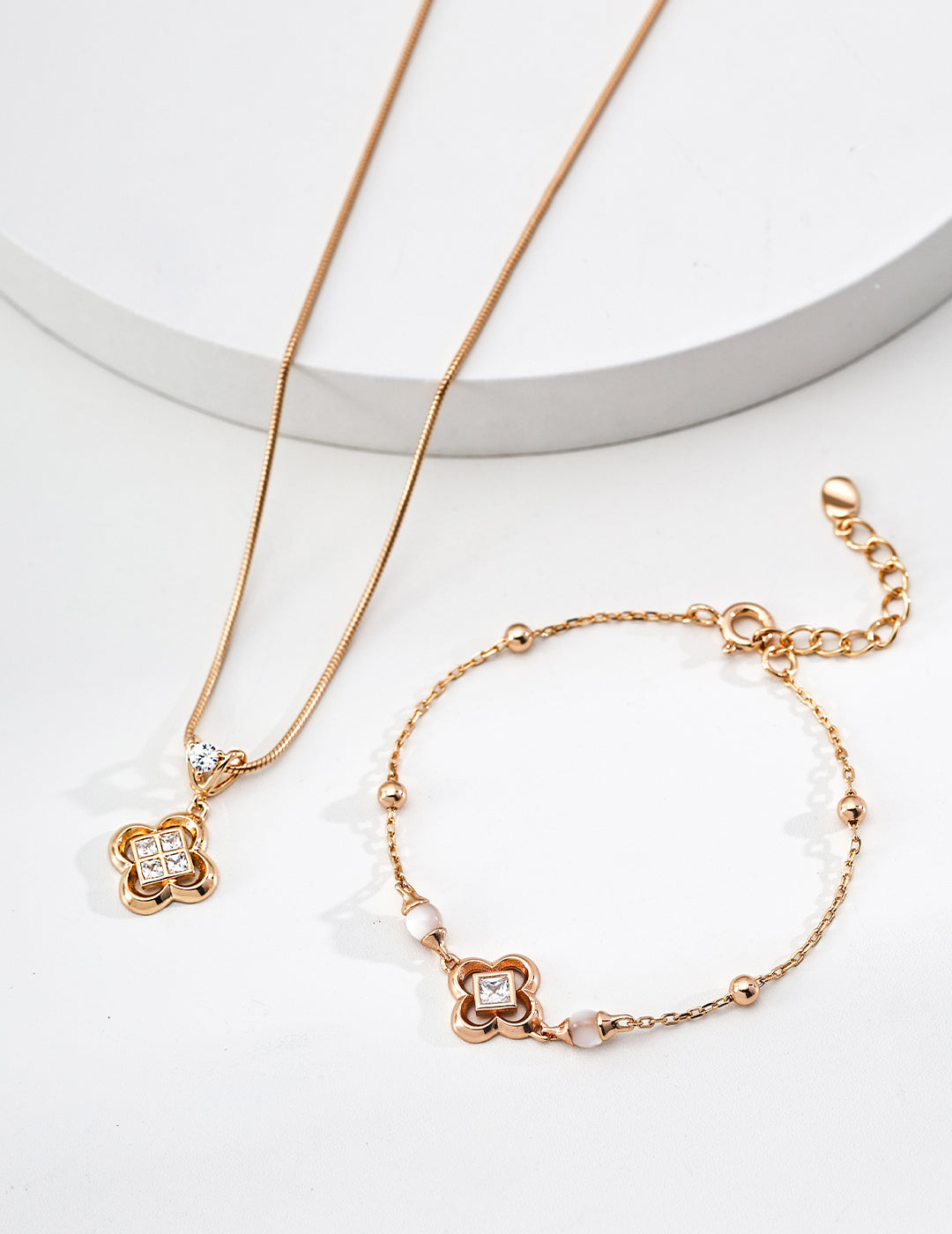 Close-up of sterling silver clover pendant showing layered zircon stone setting