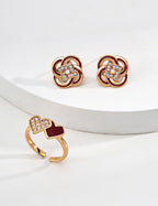 Close-up of 925 sterling silver floral enamel stud earrings with CZ accents
