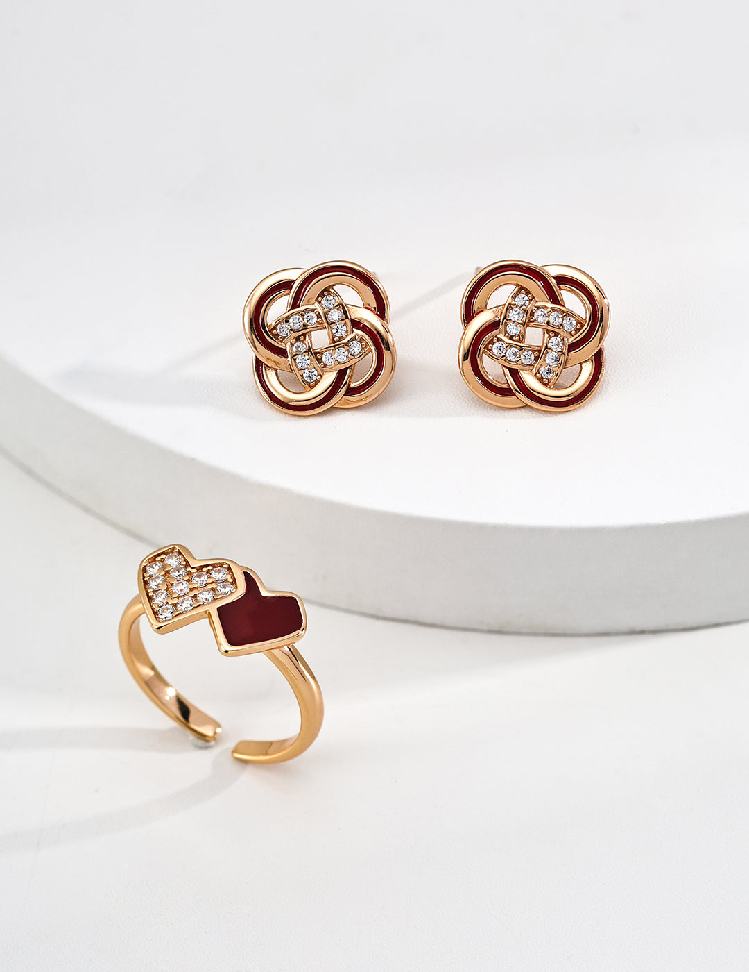 Close-up of 925 sterling silver floral enamel stud earrings with CZ accents