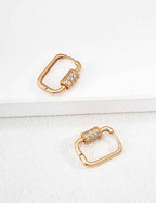 Close-up of sterling silver CZ rectangle hoop earring showing geometric form