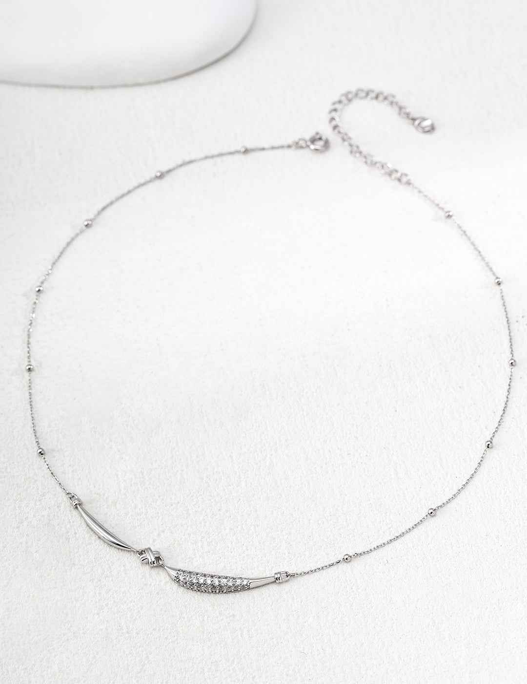 Full length view of 925 sterling silver curved bar CZ necklace, 38 cm chain