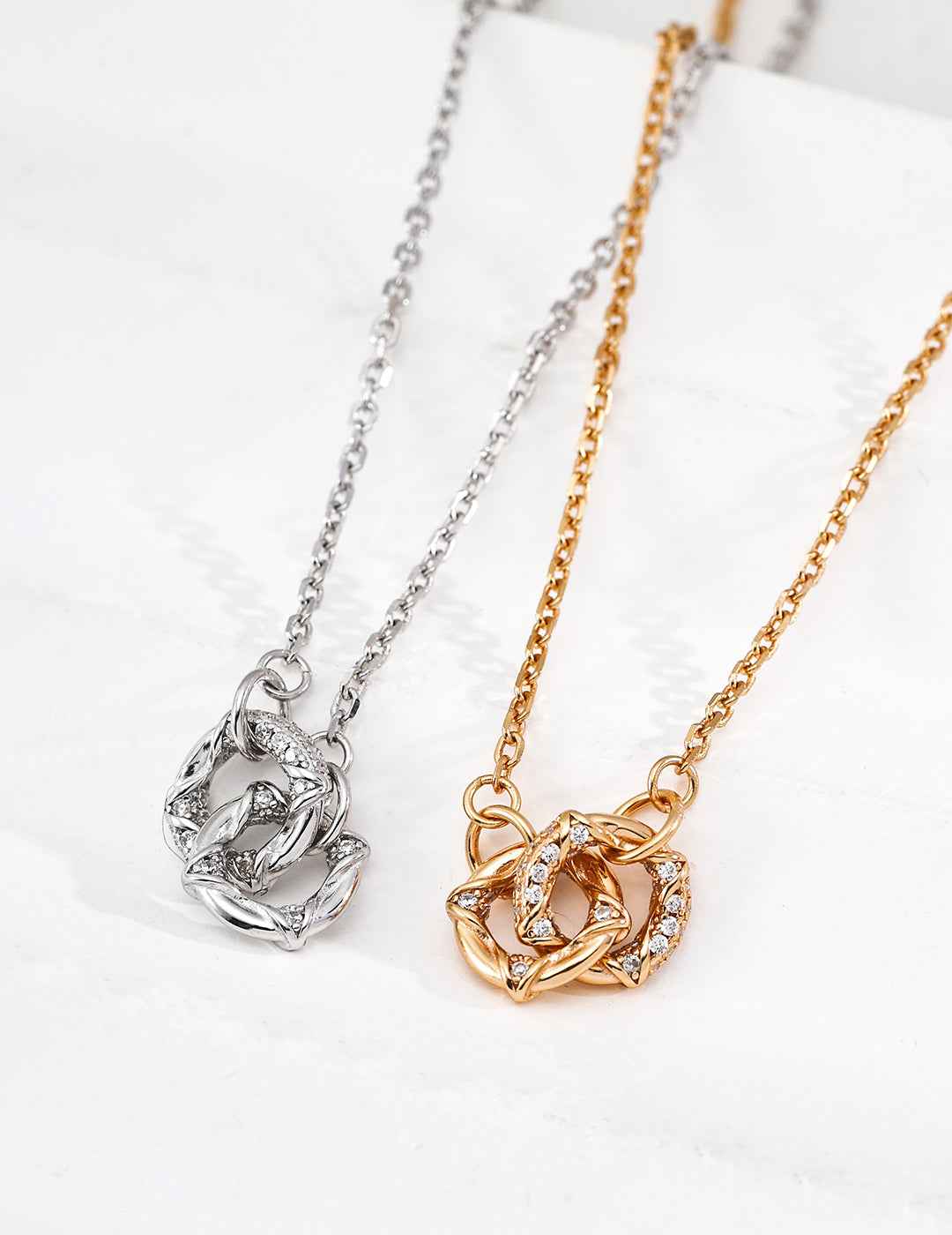 925 sterling silver knot pendant necklace with cubic zirconia accents, vintage gold tone