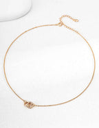 Full length view of 925 sterling silver CZ knot pendant necklace, 38 cm chain