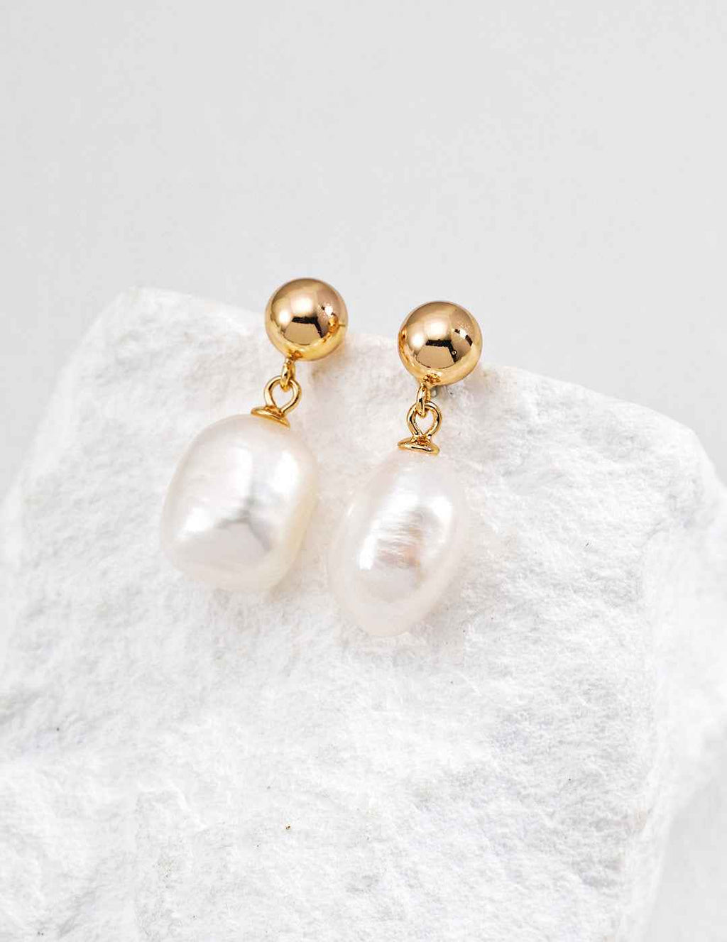 Side view of baroque pearl drop earrings showing pearl width approx. 12 mm