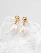 Side view of baroque pearl drop earrings showing pearl width approx. 12 mm