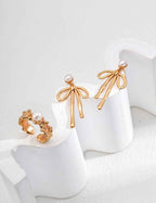 925 sterling silver bow pearl drop earrings, front view showing full silhouette