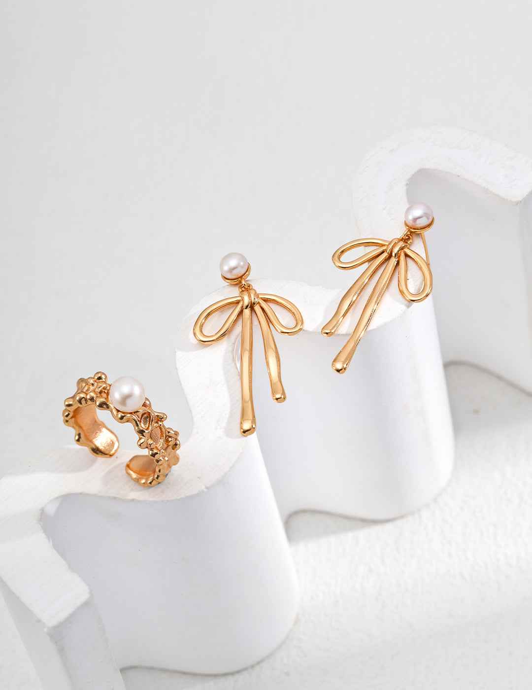 925 sterling silver bow pearl drop earrings, front view showing full silhouette