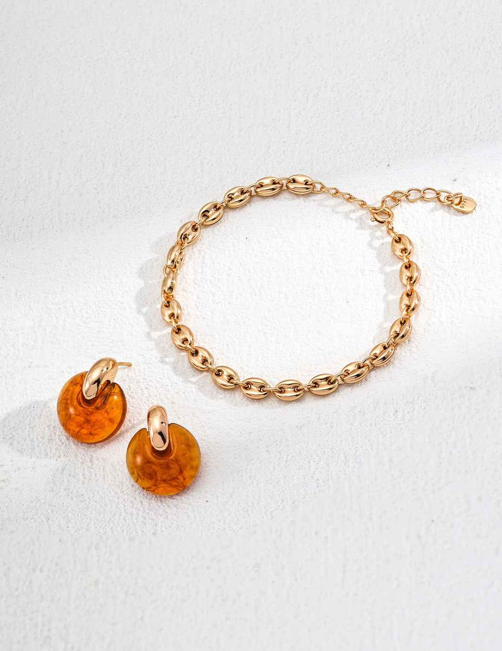 Side profile of 925 sterling silver amber-inspired resin hoop earrings showing hoop depth