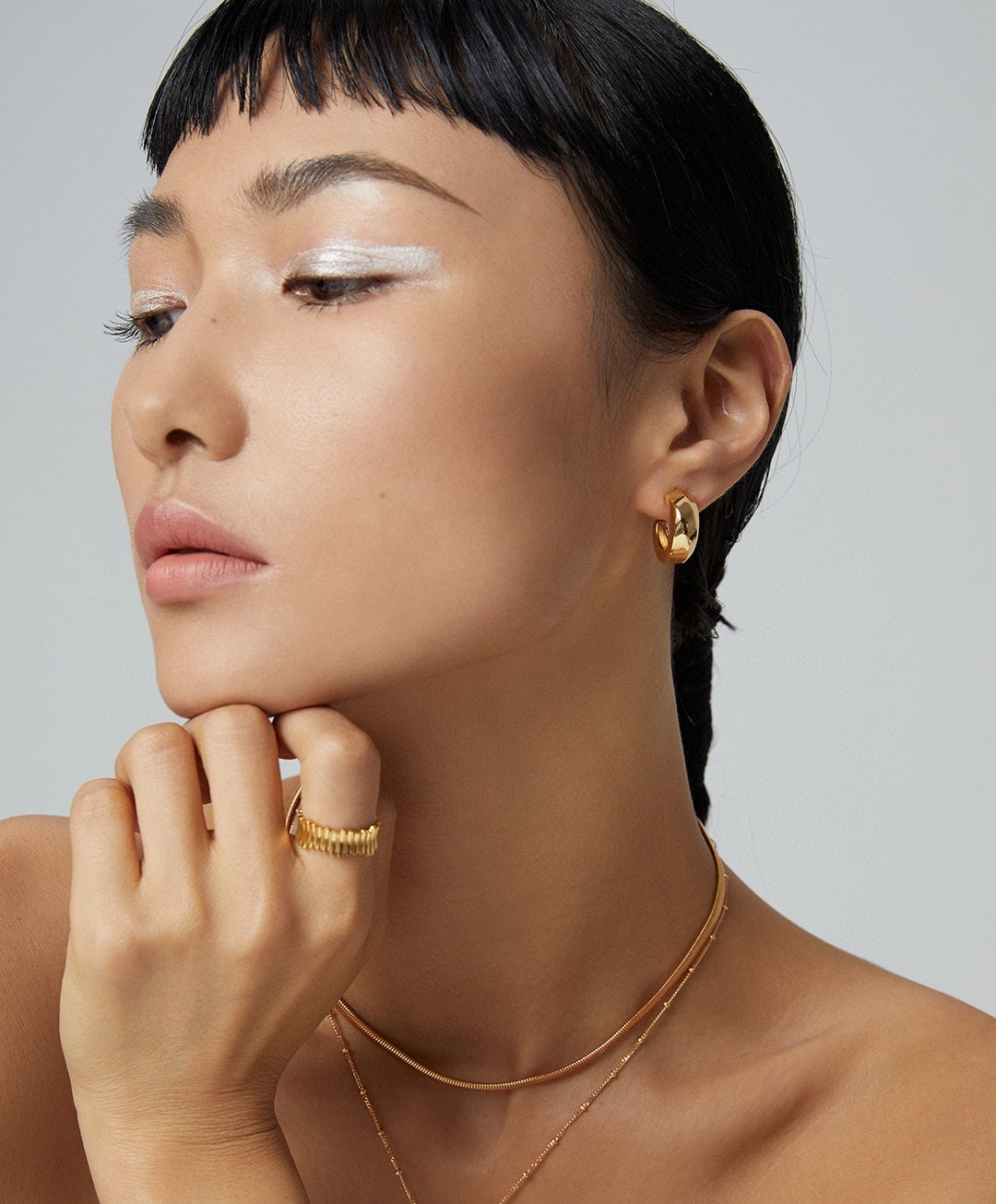 Sterling silver ring design shown in a close hand styling photograph